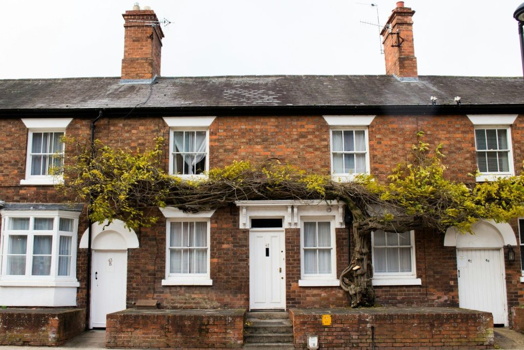 brown concrete 2-storey house